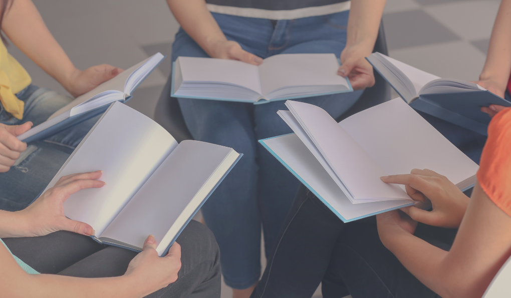 Pupils reading a school picture book in class